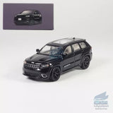 Black diecast SUV model car with detailed front grille and headlights