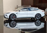 White 1:16 scale diecast model car, side view with detailed wheels and headlights