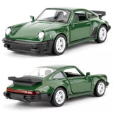 Green diecast pull-back toy car model with black front bumper and rear spoiler