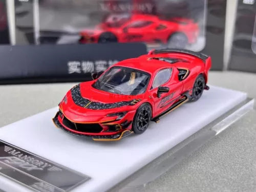 Red diecast racing sports car model with black hood stripe and rear spoiler
