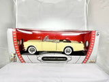 Yellow diecast 1:18 Packard Caribbean convertible model in display case