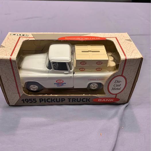 White diecast pickup truck with tan cargo box, detailed decals, in retail packaging