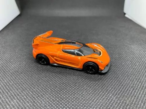 Hot Wheels diecast toy car, orange Koenigsegg Jesko style, black wheels and details