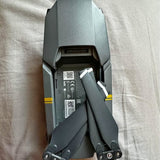 Gray foldable drone body with battery label and extended rear arm