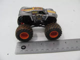 1:64 muddy die-cast monster truck, gray body, oversized black wheels, front