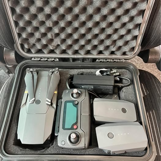DJI Mavic Pro drone kit in hard case with controller, battery, and spare parts