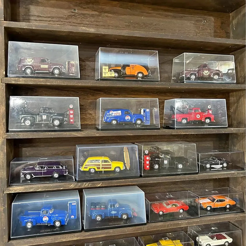 Diecast toy cars in clear display boxes, assorted colors and designs