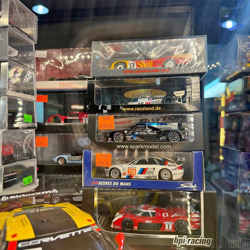 Boxed racing car diecast model with HPI Racing branding, red and black