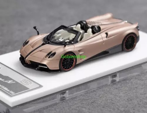 Light gold convertible diecast sports car with black wheels and interior