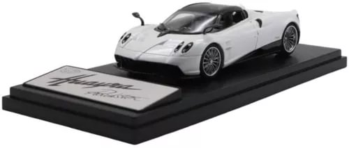 White Pagani Huayra Roadster diecast model car on black display base