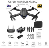 RC quadcopter drone with front camera, dark gray with black arms; includes accessories