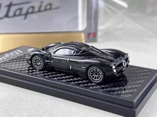 1:64 scale black sports coupe diecast car model on display base
