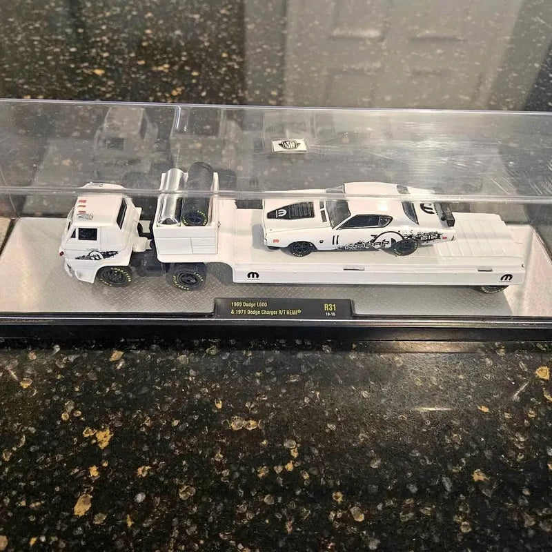 Diecast 1/64 vehicle set with three white trucks in display case