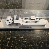 Diecast 1/64 vehicle set with three white trucks in display case
