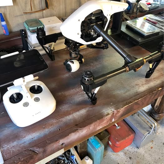 DJI Inspire 1 V2 drone with remote controller on workbench