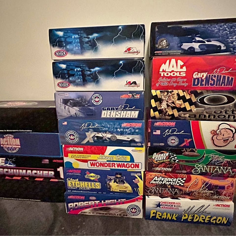 NHRA diecast racing car in retail box, featuring NHRA logos and driver artwork