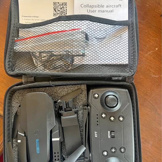 RC FPV drone controller with buttons in carrying case
