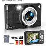 Black digital camera with lens and LCD screen; includes 32GB card and cables