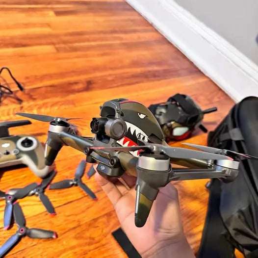 DJI FPV drone with propellers and camera in camouflage frame