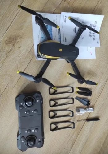 Foldable quadcopter drone with camera and dark remote controller