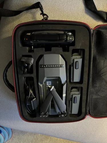 Drone carrying case with foam insert and folded prop arms