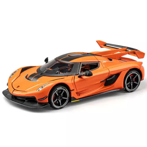Orange metal diecast model car with black wheels and rear spoiler, front 3/4 view