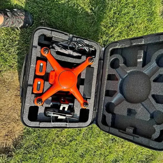 Autel X-Star Premium drone with orange frame in foam-lined hard case