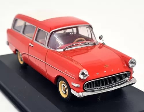 Red-orange diecast model car with front grille, headlights, and chrome bumper