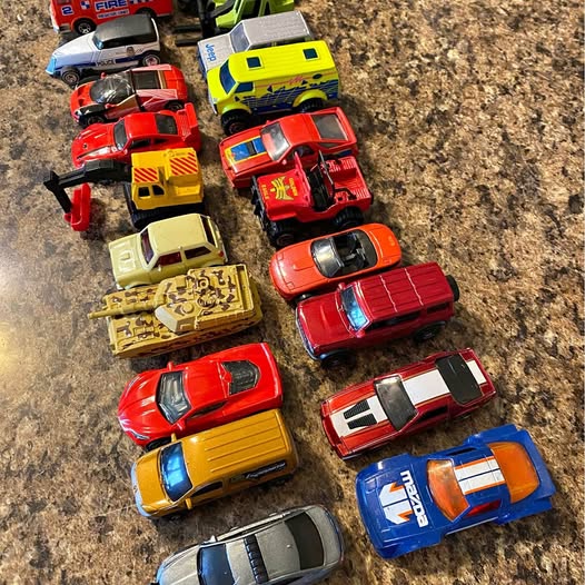 Assorted colorful diecast toy cars, mixed red yellow blue and black bodies
