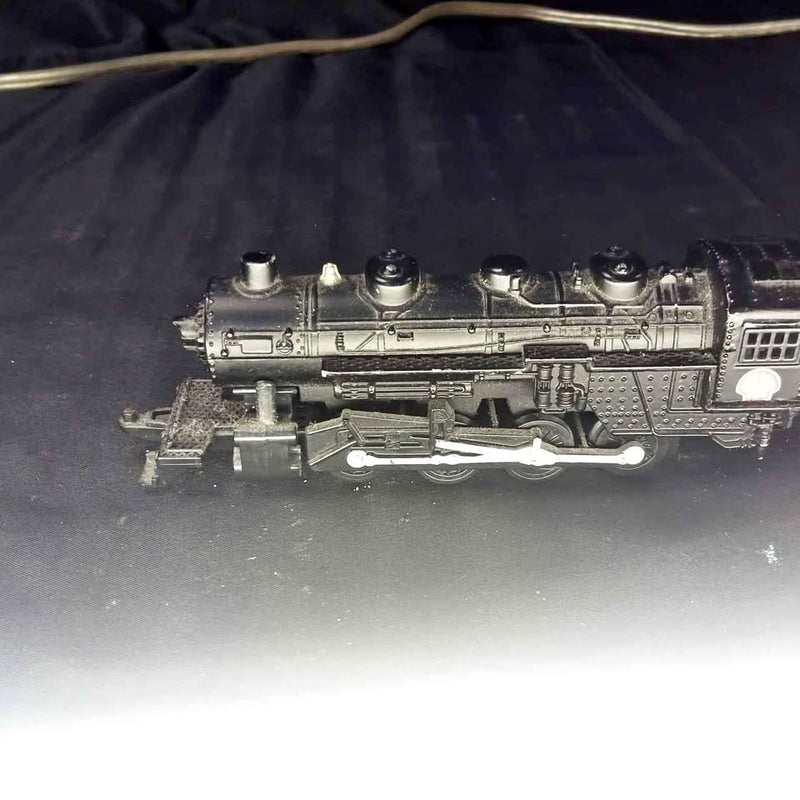 HO scale diecast steam locomotive in silver with dark details
