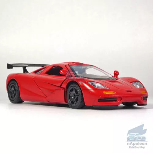 Red alloy diecast model car with black wheels, front three-quarter view.