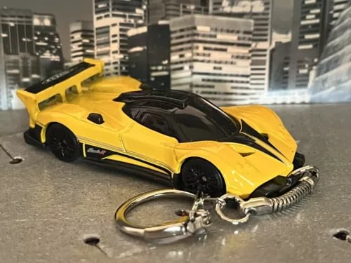 Yellow diecast sports car keyring with black hood and chrome keychain ring