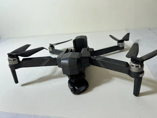 Gray quadcopter drone with gimbal camera and 4 propellers
