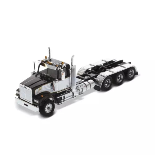 Diecast Masters tractor truck model with day cab, chrome fuel tanks, and tridem wheels