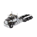 Diecast Masters tractor truck model with day cab, chrome fuel tanks, and tridem wheels