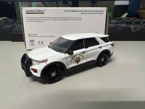 Police interceptor diecast toy car, white with black wheels and CHP graphics