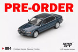 Dark blue diecast BMW sedan model car, front three-quarter view