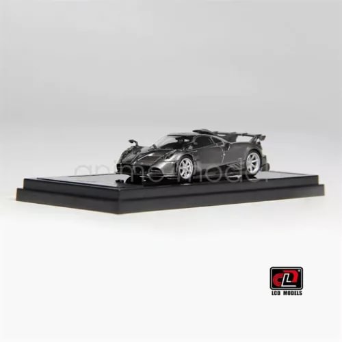1:64 metallic grey diecast model car with black display base, detailed body