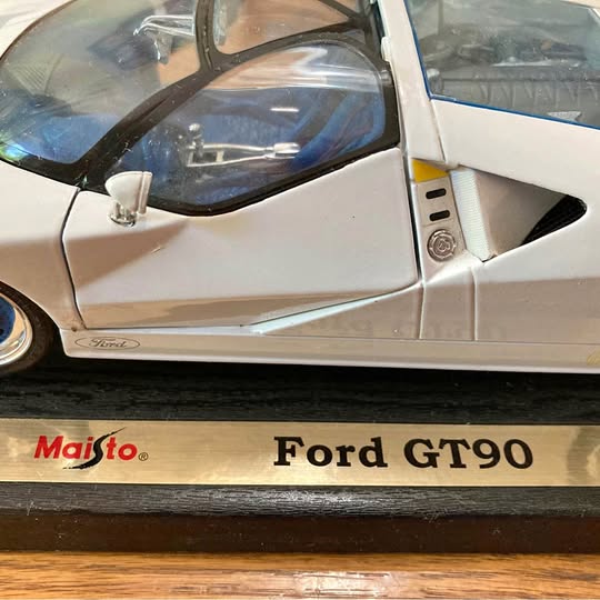 Diecast model car Ford GT90 with Maisto logo on base, light blue and white