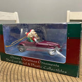 Die-cast Plymouth Prowler Christmas ornament, red car with Santa figure on hood