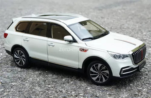 White diecast SUV model car, front three-quarter view with grille and headlights