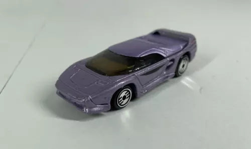 1:64 diecast model car in dark purple with black wheels and side stripes