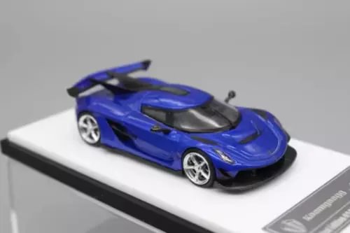 Blue sports model diecast car with black hood and silver wheels