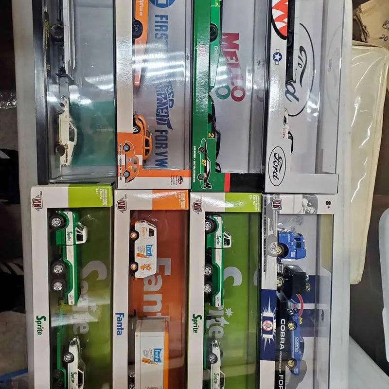 Diecast truck toy set in blister retail packaging, assorted colors