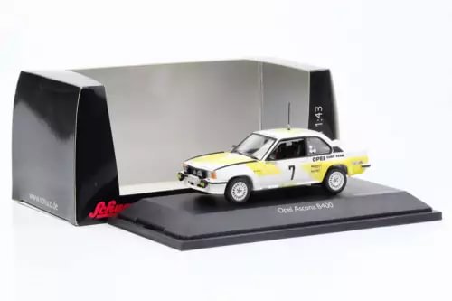 Diecast race car model with white and yellow livery and number 7, in display case
