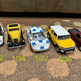 Diecast car set with yellow, white-blue patterned, and yellow vehicles
