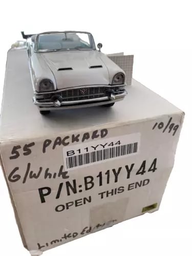 1:24 scale diecast convertible car model in light blue on labeled box
