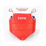 Red taekwondo chest protector with THYD front logo and white trim, blue strap loops
