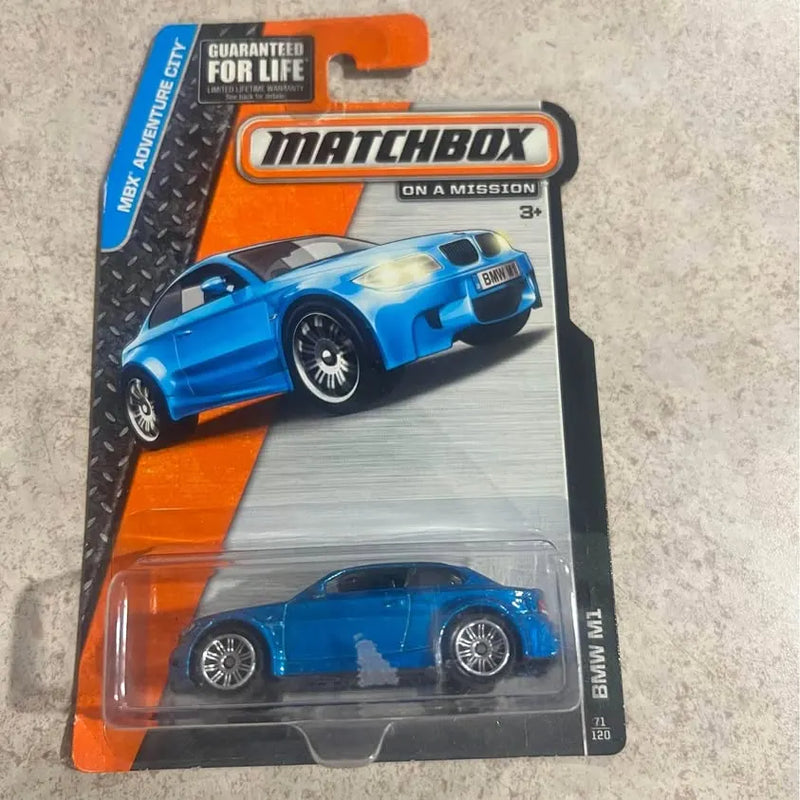 Blue BMW M1 diecast car in blister pack, 1/64 scale