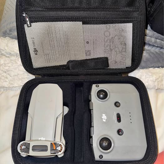 DJI Mini 2 drone and remote controller in a black carrying case